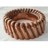 Copper jelly mould with gadroon sides. 7 inch diameter