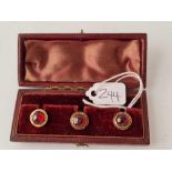 A boxed Victorian set of three gold and cabochon garnet studs