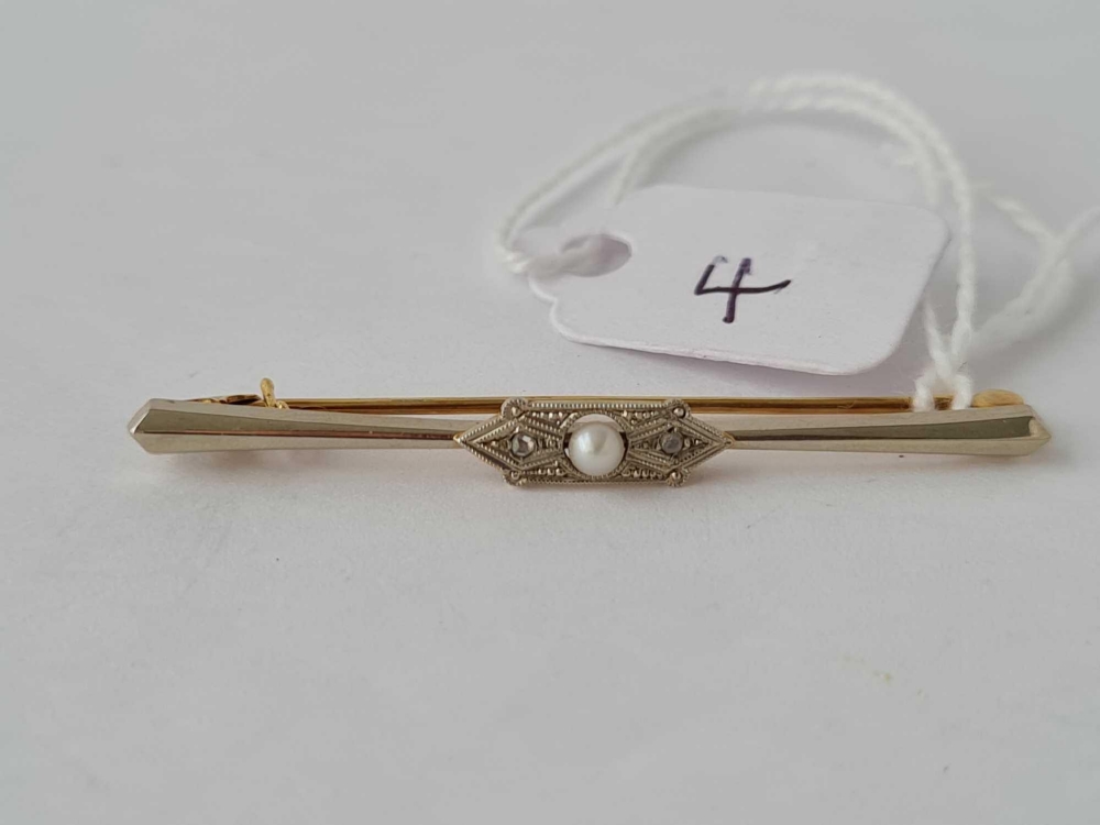 A pretty gold bar brooch set with seed pearls and diamonds 14ct gold