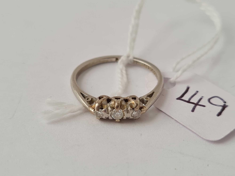 A three stone diamond and platinum ring size O - 3.2 gms