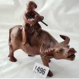 Carved Oriental figure on a water buffalo. 6 inch long