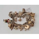 A silver charm bracelet - 92 gms