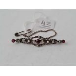 A Victorian ruby and diamond and pearl brooch set in silver and gold