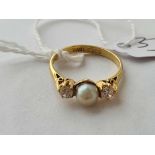 A pearl and C.Z. three stone ring 9ct size N1/2 - 2.1 gms