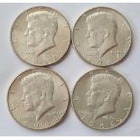Four 1964 Kennedy half-dollars