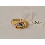 A two part 18ct gold diamond and emerald fitting rings size M 3.9g