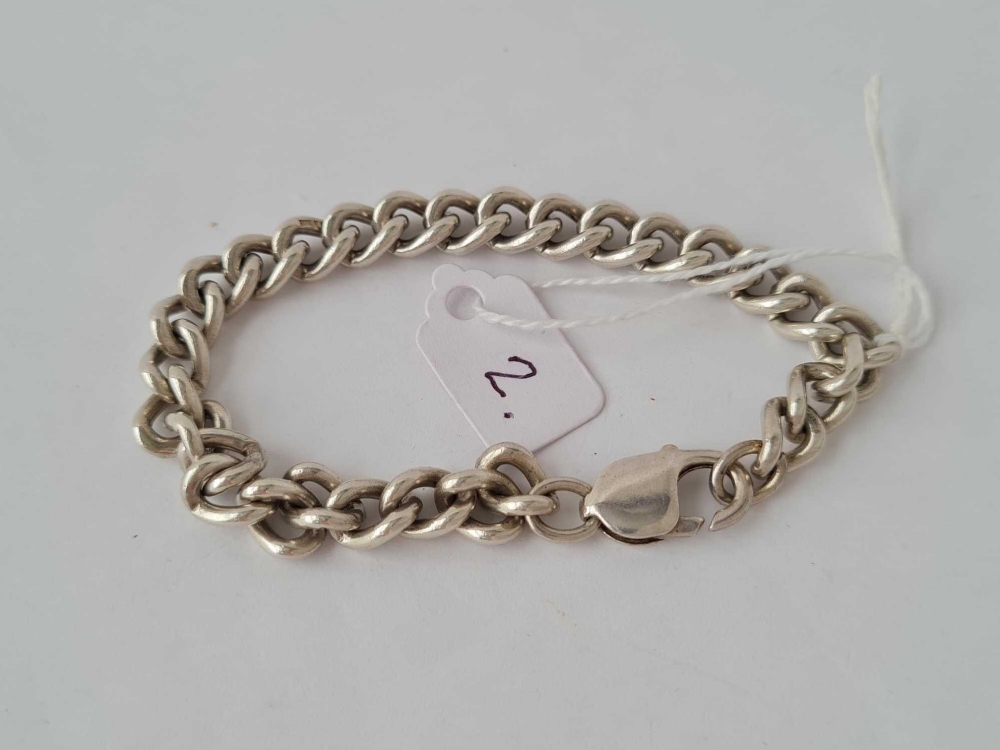 A silver curb link bracelet - 29.5 gms