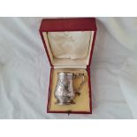 A boxed Victorian tankard with leaf capped double scroll handle - 4.25" high - London 1885 by WH -