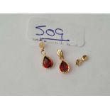A pair of garnet earrings 9ct