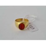 ANTIQUE GOLD SIGNET RING SET WITH A ROMAN CORNELIAN INTAGLIO OF A WOMAN IN A LONG DRESS AND SNAKE TO