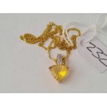 A diamond and citrine pendant necklace