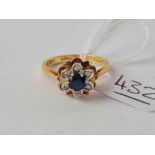 A sapphire and diamond cluster ring 18ct gold size N1/2 - 4.1 gms