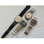 A collection of four gents wrist watches
