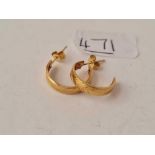 A pair of half hoop earrings 9ct