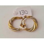 A pair of half hoop earrings 9ct - 1.3 gms