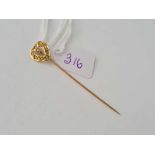 A gold and seed pearl heart shaped stick pin (one pearl missing) 10ct gold