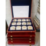 6x Cased sets of commemorative coins Titanic Aviation etc
