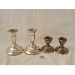 Two pairs of candle sticks with reeded rims, one pair 3.5" high, B'ham