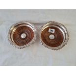 A pair of Mathew Boulton wine coasters with crested centres