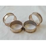 A set of four napkin rings each with vacant cartouche, B'ham 1931