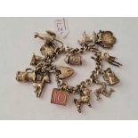 A Vintage silver charm bracelet - 68 gms