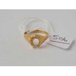 A horse shoe shaped ring 9ct size O1/2 - 1.5 gms