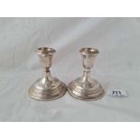 A pair of Dutch silver candlesticks with reeded rims - 3" high