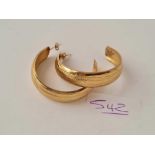 A pair of large hoop earrings 9ct - 4 gms