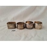 Pair of barrell shaped napkin rings and two others. 82gms