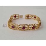 A NICE RUBY BRACELET 9CT - 26 GMS