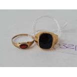 Two rings one onyx with split shank and one red stone both 9ct size M - 4.5 gms