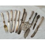 Silver handled knives and forks, some continental.