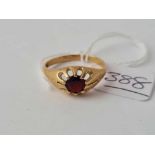 A garnet set ring 9ct size Q - 2.5 gms