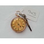 A ladies fob watch, complete with key in 14 ct gold