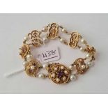 A ATTRACTIVE PEARL AND AMETHYST BRACELET 14CT GOLD 28.3 GMS