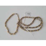 A silver bead necklace and matching bracelet 41g