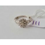 A white gold diamond cluster ring with diamond shoulders 9ct size L - 2.6 gms