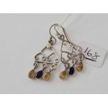 a pair of silver drop stone set earrings