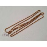 A antique long gilt chain with dog clip fitting