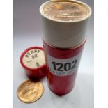 Red tube of 50 half-pennies 1967