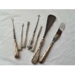 Seven silver handled items.