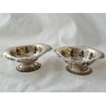 A pair of embossed Indian silver salts, 4" wide, w.126g