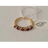 A ruby and diamond 18ct gold half eternity ring size L ½