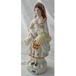 Staffordshire figure of girl with jug and sheaf of corn. 12 inch high
