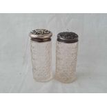 Two bottles with embossed covers, cut glass bodies - one London 1905