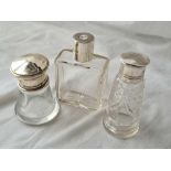 Three screw top scent bottles with glass bodies.