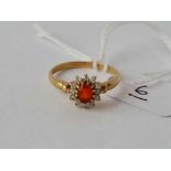 A 9ct red stone cluster ring size O