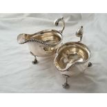 Pair of sauce boats with gadroon borders leaf cap scroll handle.6.5 inch wide. London 1915. 508gms