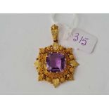 A STUNNING GEORGIAN AMETHYST CANNETILLE PENDANT SET IN HIGH CT GOLD WITH LEAF DESIGN 15MM DIAMETER