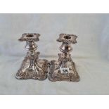 A pair of candlesticks with decorative rims - 6" high